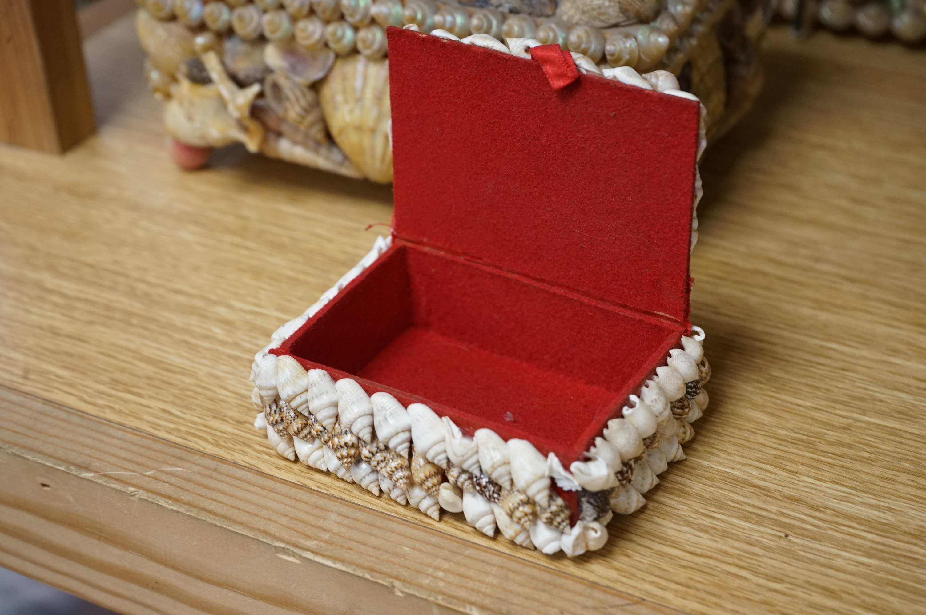A near pair of French shell applied wall mirrors and three similar boxes, largest 29cm high